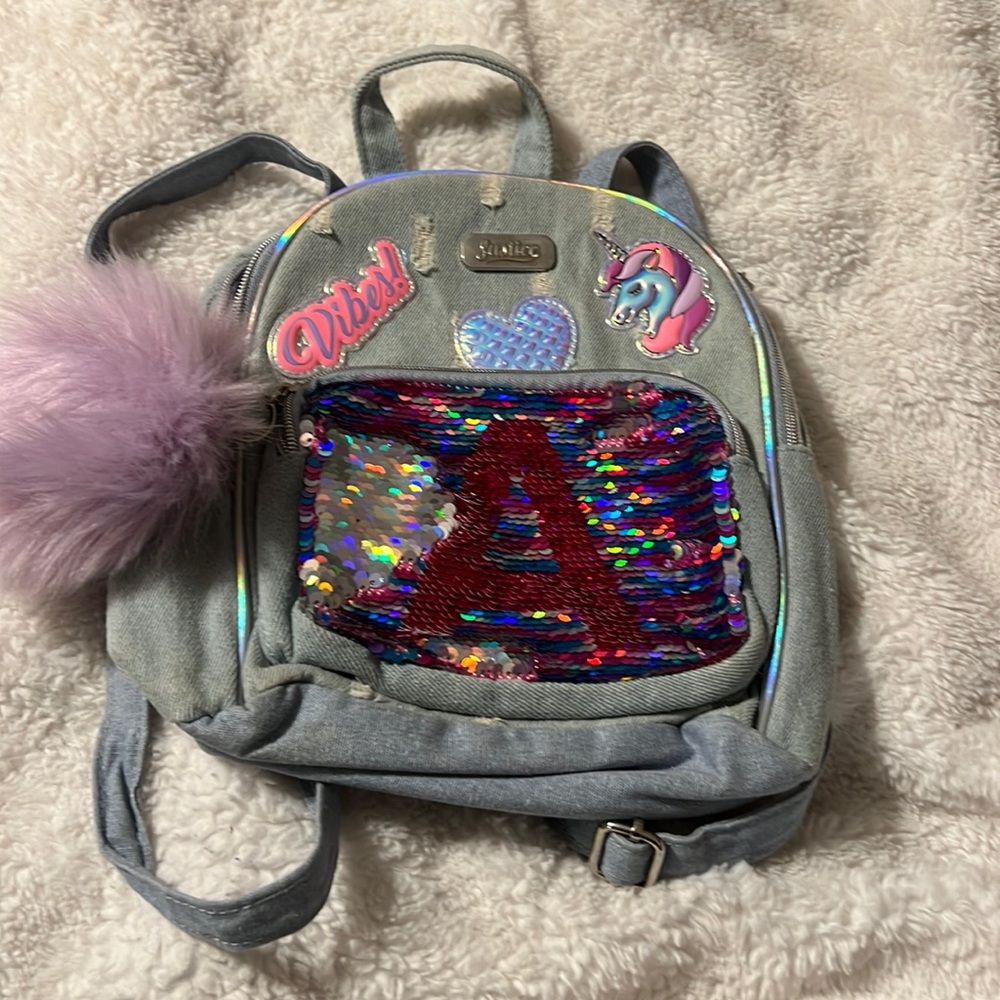 Excellent condition justice mini back pack/purse with letter A on the front